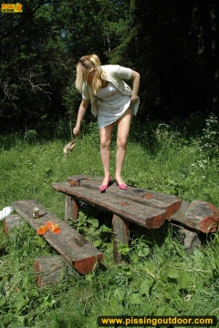 Pissing outdoor on a wooden table - N