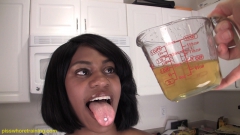 Ebony babe drinking her own pee in the bowl - N