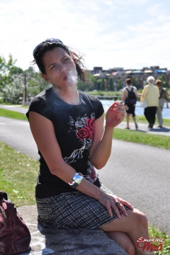 Brunette babe smoking at the park - N