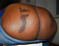 Big fat ass initials tattooed - N