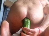 filling white ass with cucumber